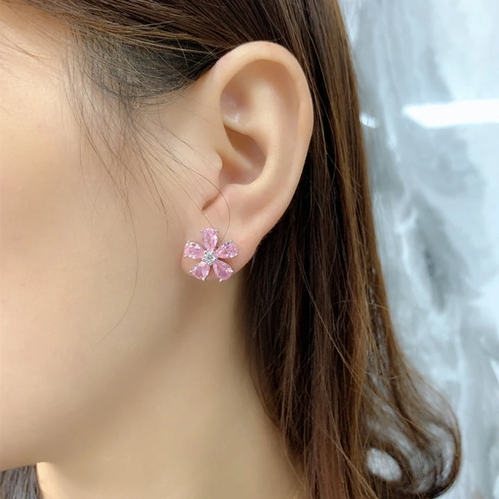 Pink five-petal gemstone flower stud earring with small prong details on silver-tone post
