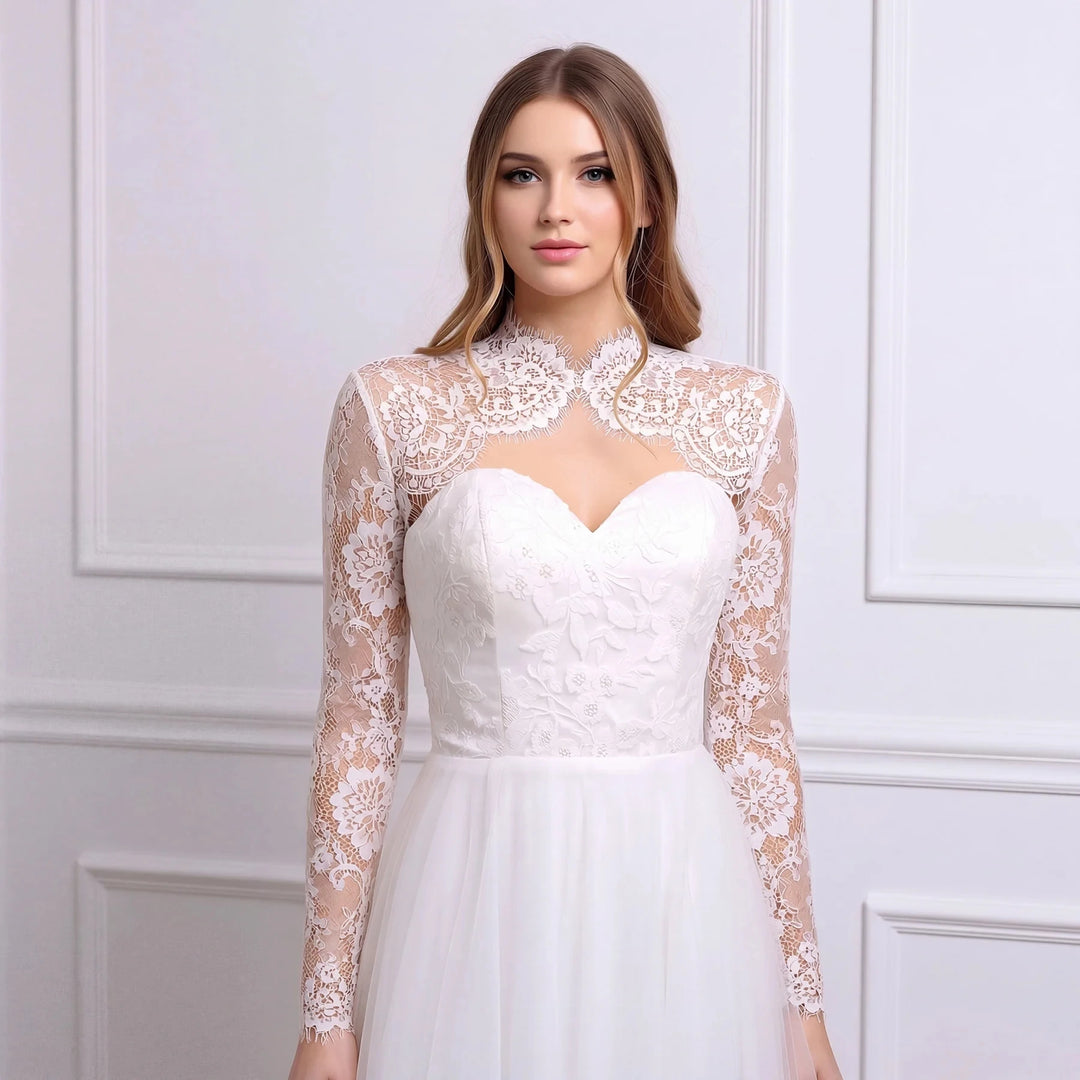 White lace bridal jacket with high scalloped collar and sheer long sleeves