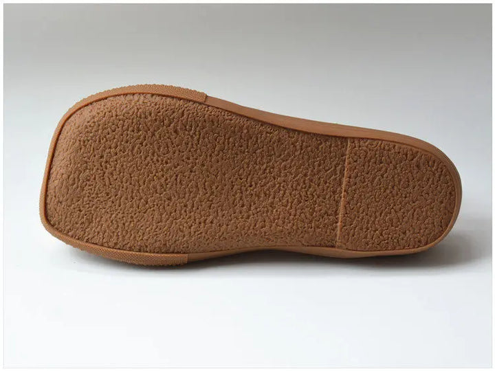 Coffee brown woven leather shoe outsole, textured tread bottom view