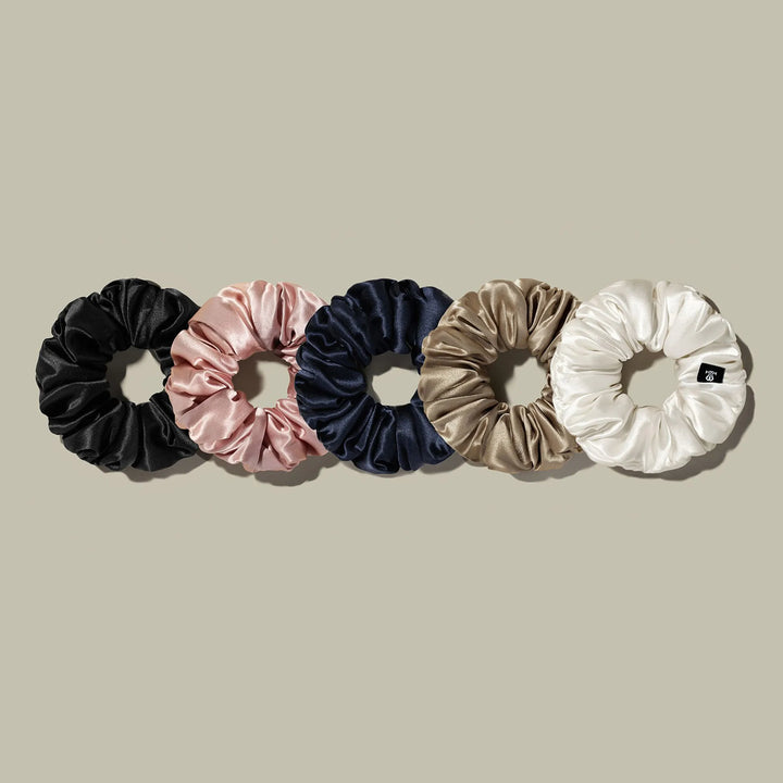 Assorted satin scrunchie ponytail hair bands in black, pink, navy, beige, and white