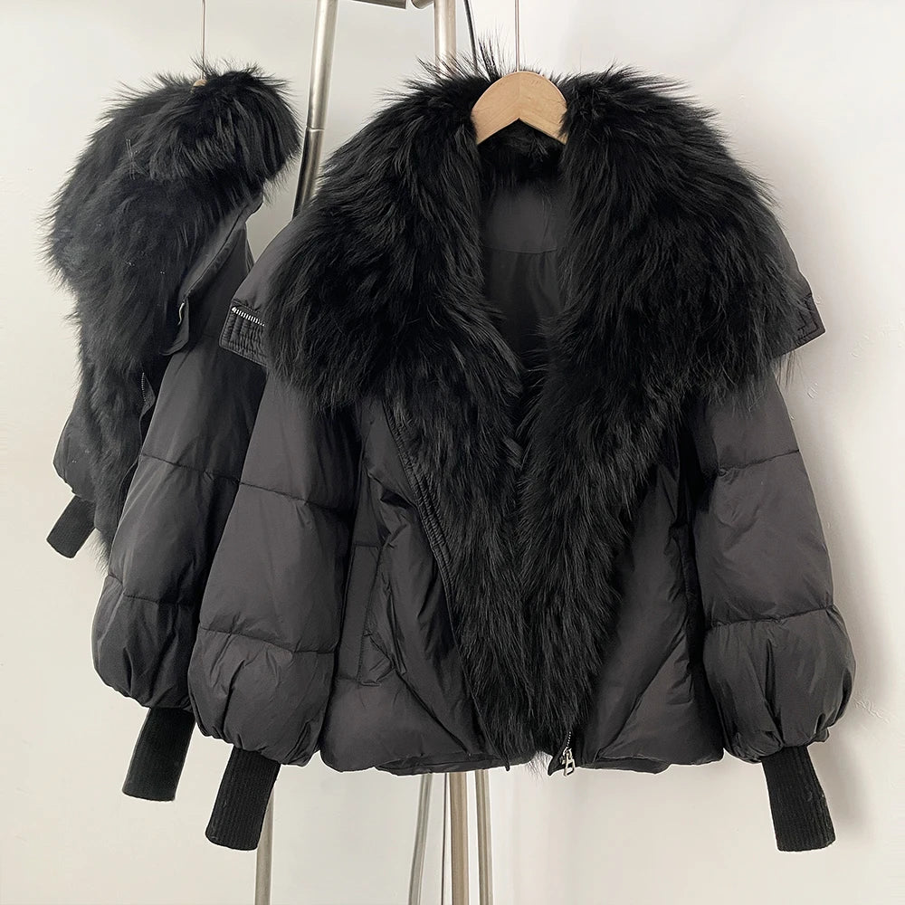 Dark puffer coat with large black faux-fur collar and front zip, rib-knit cuffs