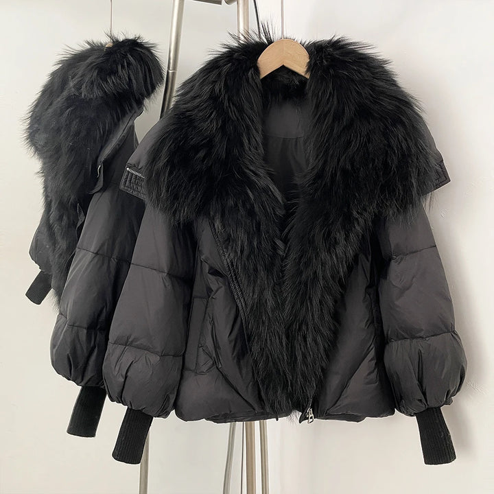 Dark puffer coat with large black faux-fur collar and front zip, rib-knit cuffs