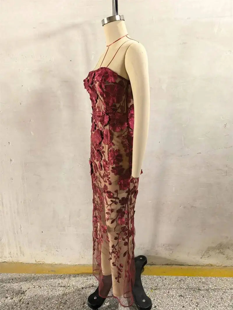 Burgundy sheer 3D floral lace gown on mannequin, side view