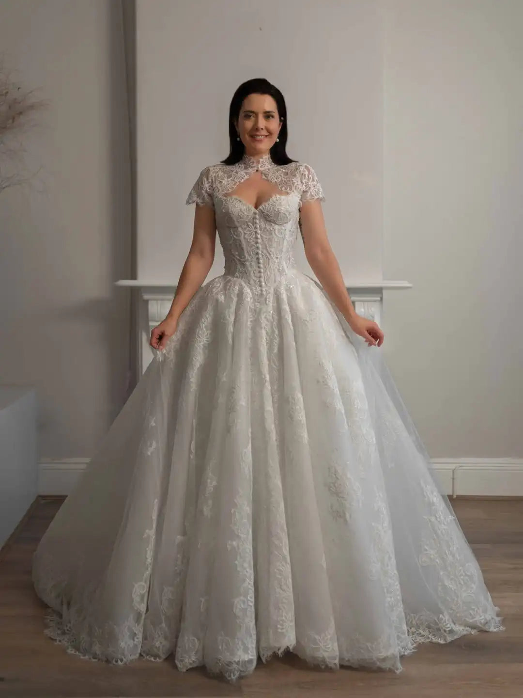 Ivory lace corset A-line bridal gown with short puff sleeves and sweetheart neckline