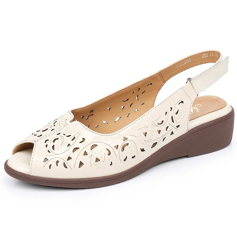 Beige open-toe slingback wedge sandal with perforated leather upper and ankle strap