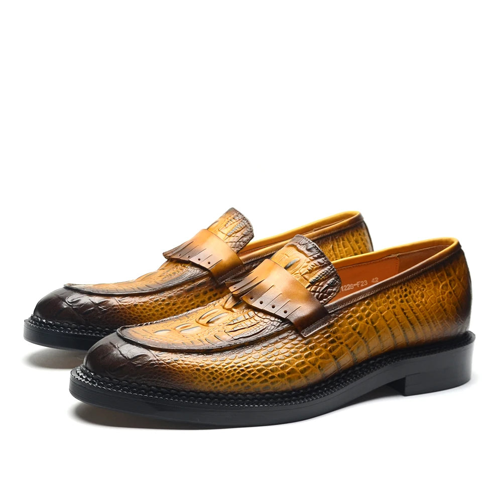Pair of brown leather loafers on a white background