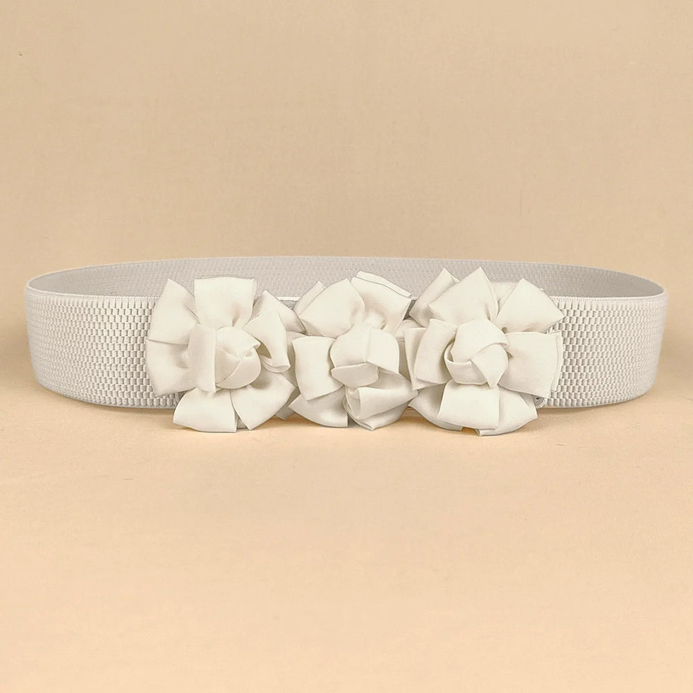 White corset waist belt with three fabric flower appliques across the front