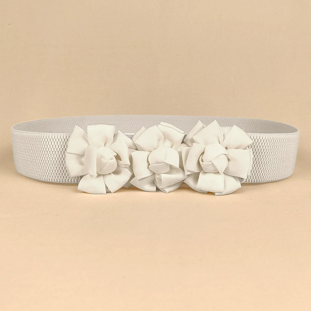 White corset waist belt with three fabric flower appliques across the front