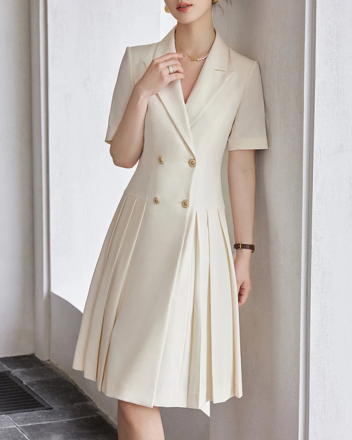 Beige A-line dress with notched lapels, short sleeves, pleated skirt, gold buttons