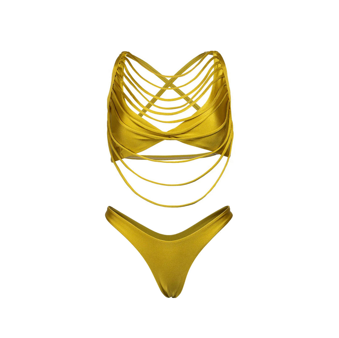 Golden crochet bikini top with crisscross straps, high-cut bottom, and cover-up pants.