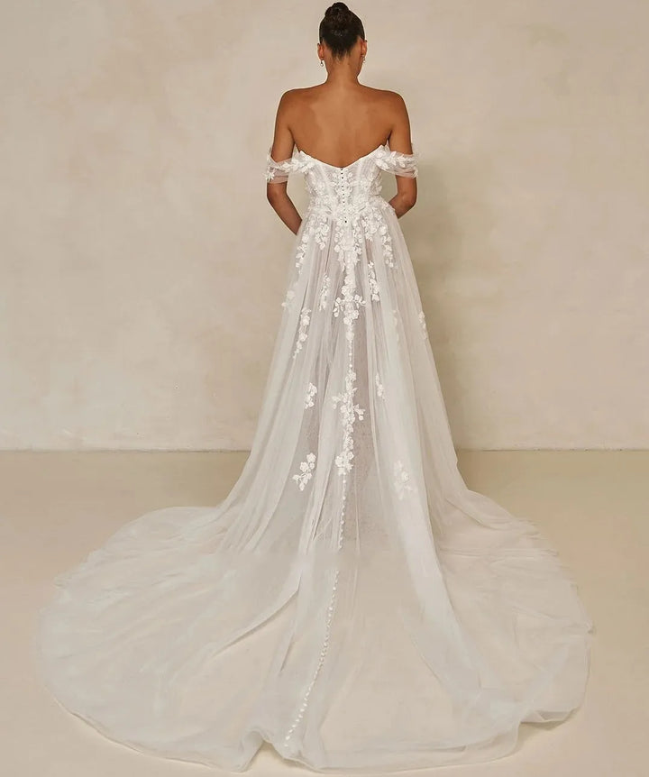Off-shoulder floral lace bridal dress with long train, back view