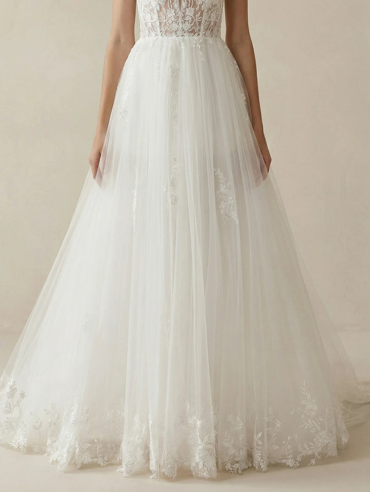White tulle bridal gown with lace bodice and full floor-length skirt