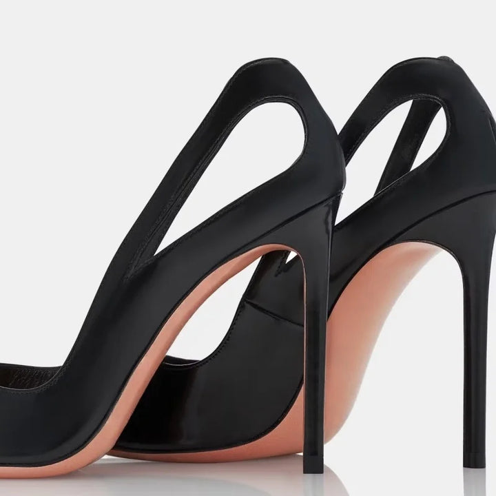 Pair of black slip-on pointed-toe stiletto heels with U-shaped openings