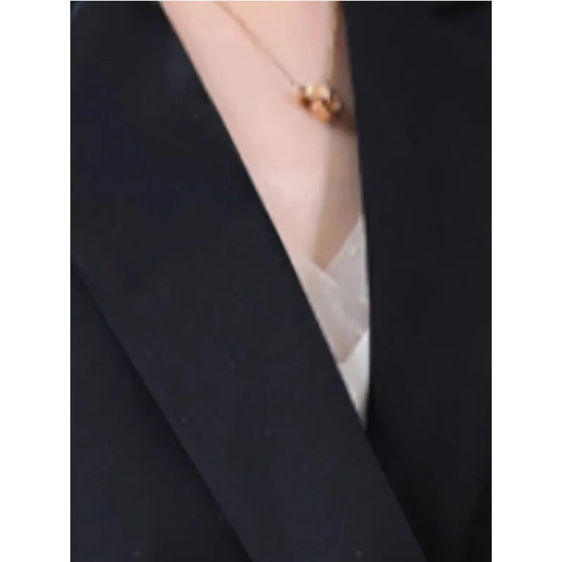 Black sleeveless blazer vest V-neck lapel with clean open front edge