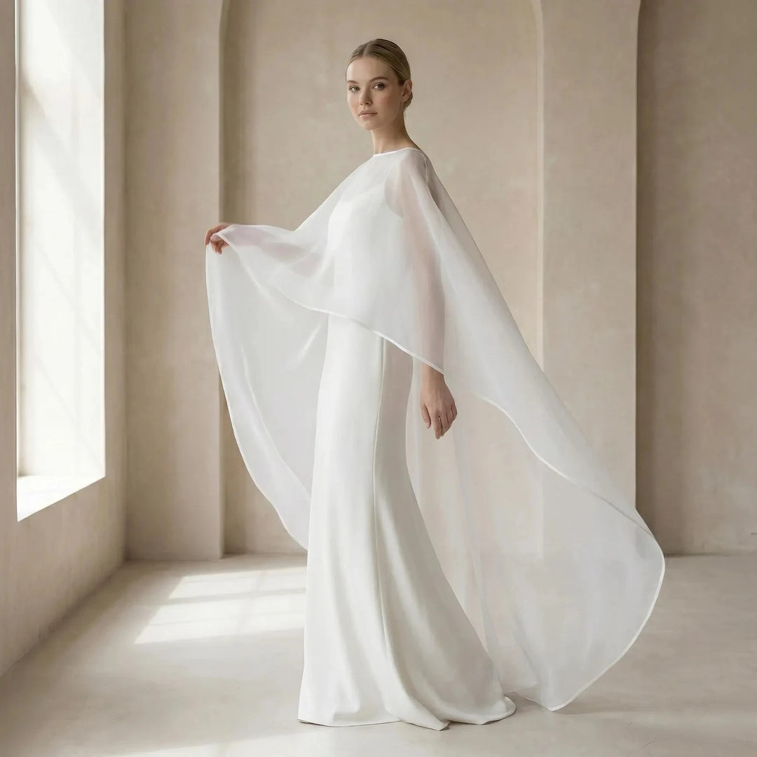 White organza bridal cloak front view with airy sheer cape overlay and long length