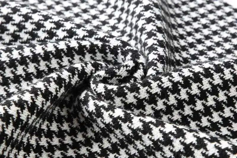 Men’s black-and-white houndstooth knit T-shirt fabric close-up