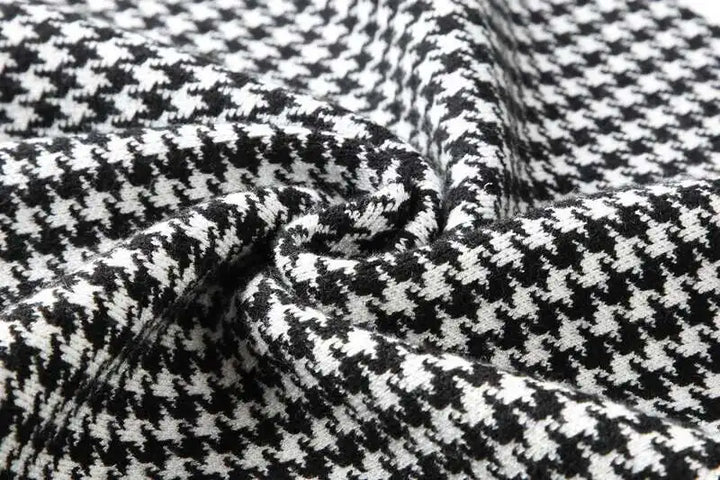 Men’s black-and-white houndstooth knit T-shirt fabric close-up