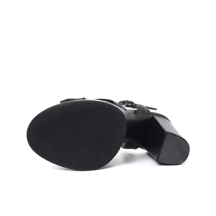 Black platform sandal outsole with textured tread and strap hardware