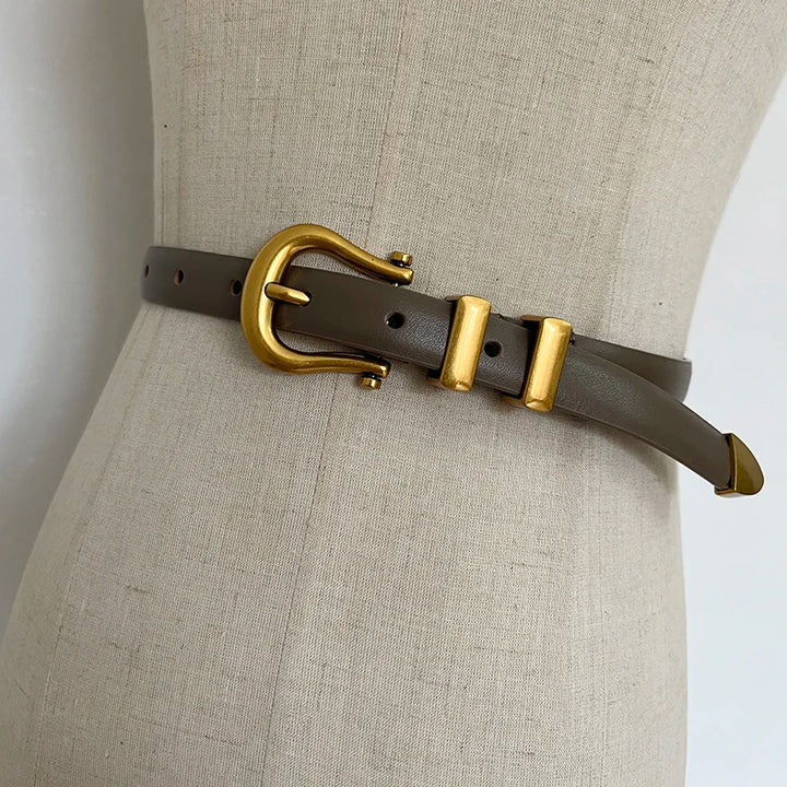 Brown narrow leather corset belt with gold-tone oval buckle and two rectangular tabs