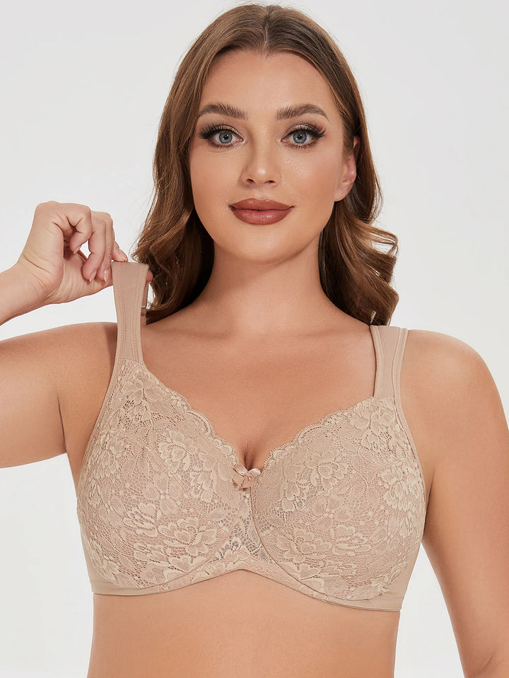 Beige lace underwire bra front view with one strap adjusted by hand