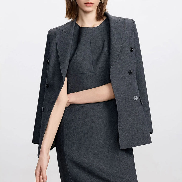 Dark gray two-piece skirt suit, blazer and pencil skirt with button details