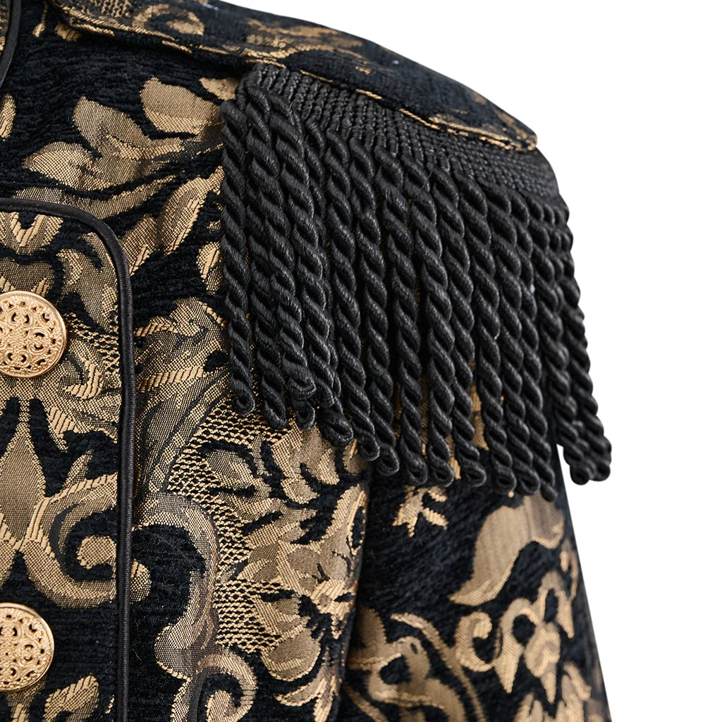 Close-up of black fringed shoulder and gold patterned fabric on steampunk coat