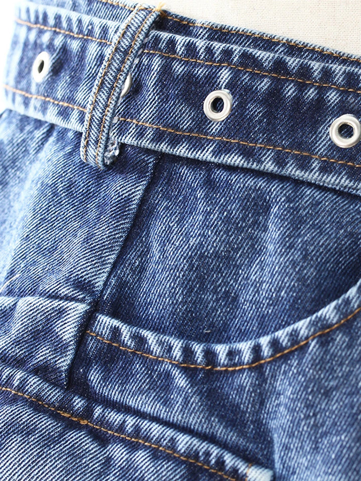 Dark blue denim flared skirt waistband curve and side pocket seam detail