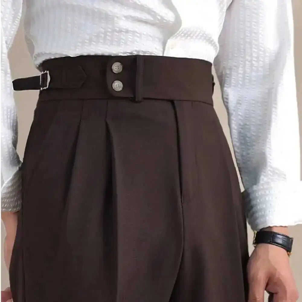 Dark brown linen-blend formal pants close-up, two-button waistband and pleated front