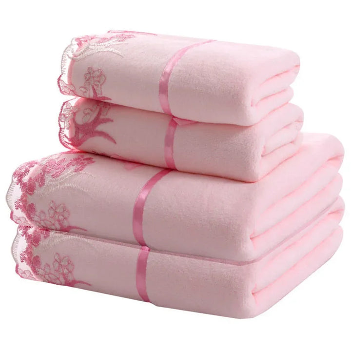 Pink lace-pattern microfiber towels, neatly folded in a three-stack