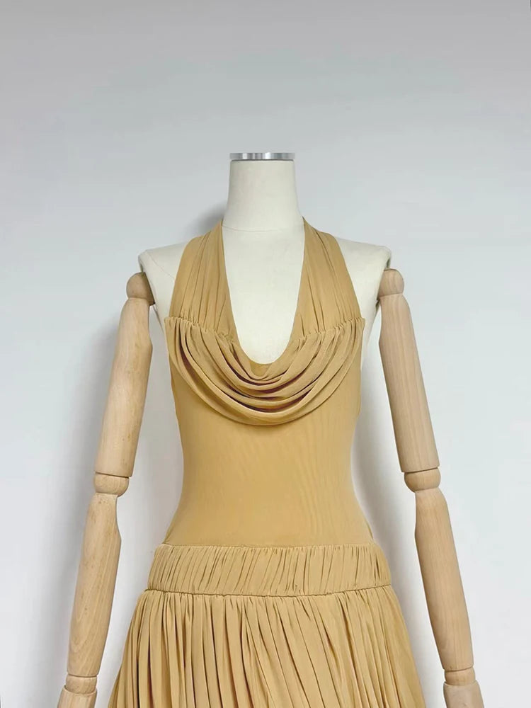Beige sleeveless pleated mini dress with cowl neckline and gathered waist