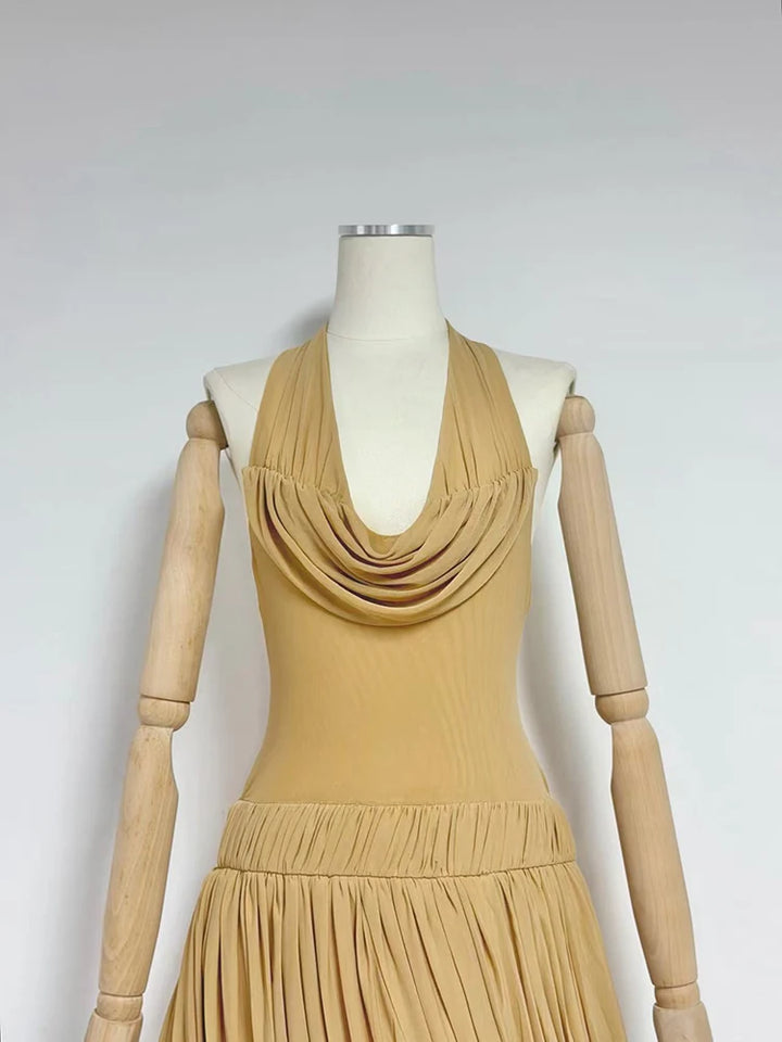 Beige sleeveless pleated mini dress with cowl neckline and gathered waist
