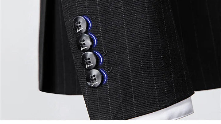 Black pinstripe suit close-up of pocket flap, buttons, and lapel trim detail
