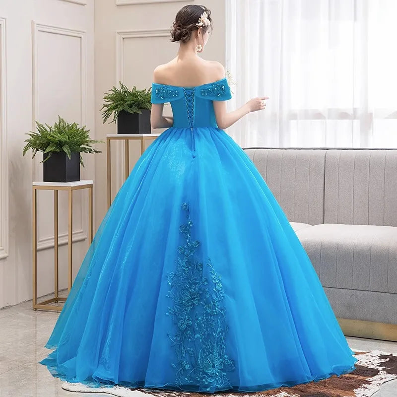 Lake blue off-shoulder party dress viewed from back with full tulle skirt