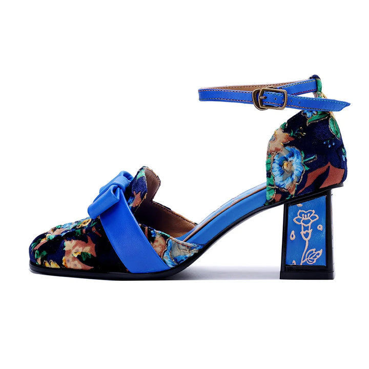 Side view of blue floral heel sandals with buckle strap and patterned block heel