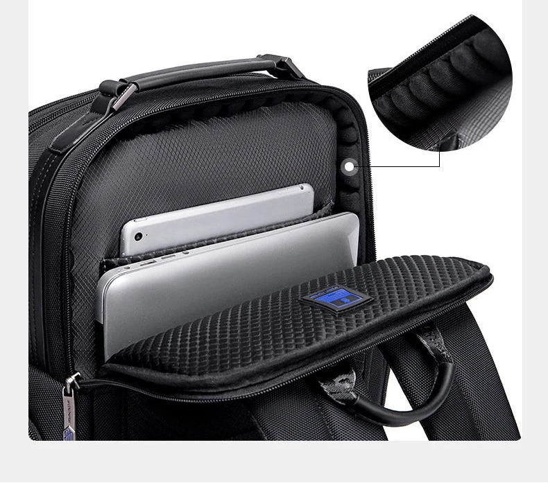 Black backpack with padded shockproof computer compartment and open zipper pocket
