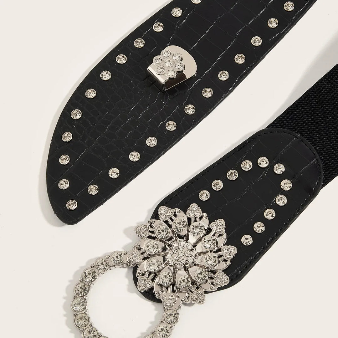 Black PU corset belt with studded strap and rhinestone flower buckle detail