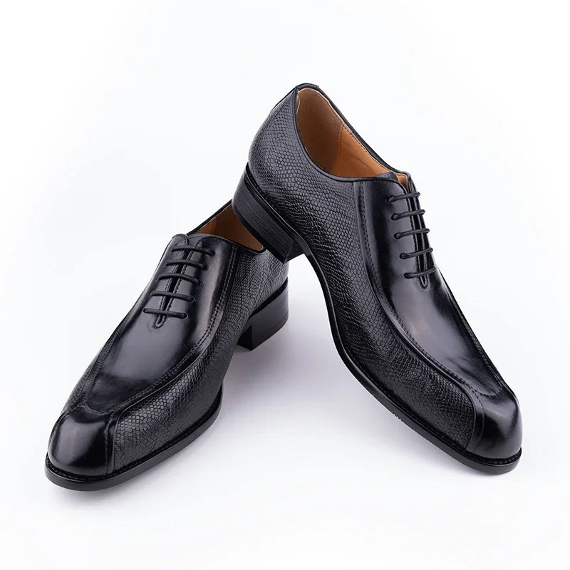Black leather oxford dress shoe pair, lace-up front with textured leather upper