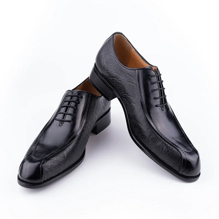 Black leather oxford dress shoe pair, lace-up front with textured leather upper