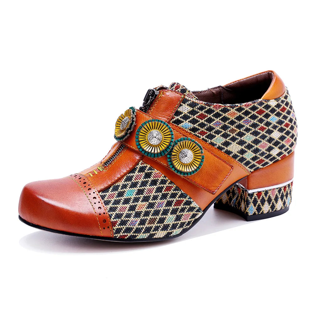 Orange women's slingback dress shoe with patterned upper, jeweled circular strap, and block heel