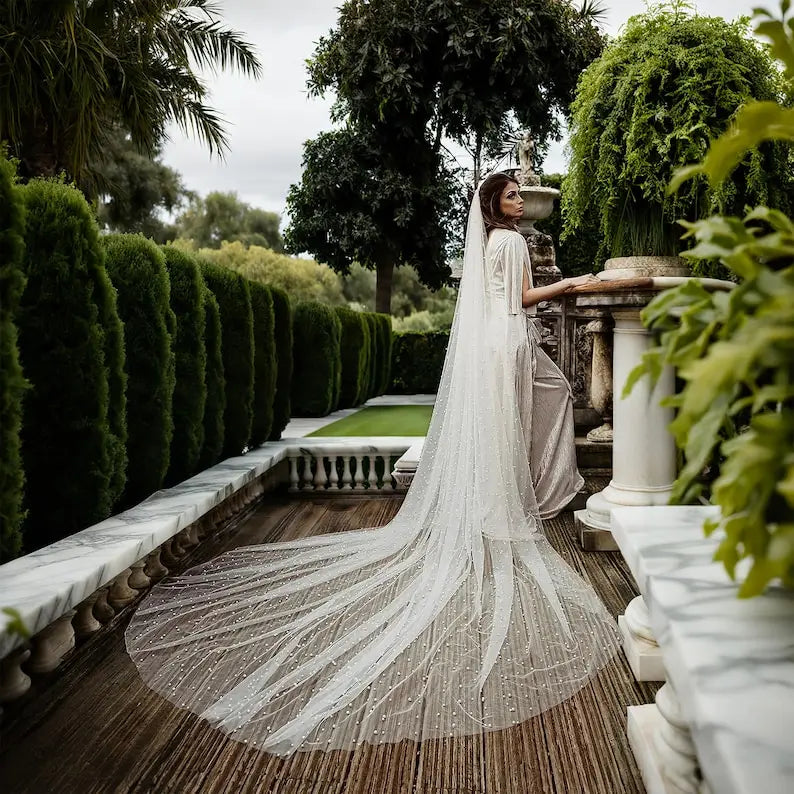 Ivory sheer bridal veil with pearl beaded trim, long flowing edge