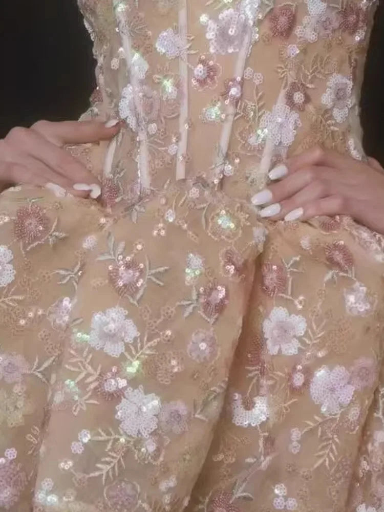 Beige sequin-embroidered bodice with detailed floral and leaf appliques