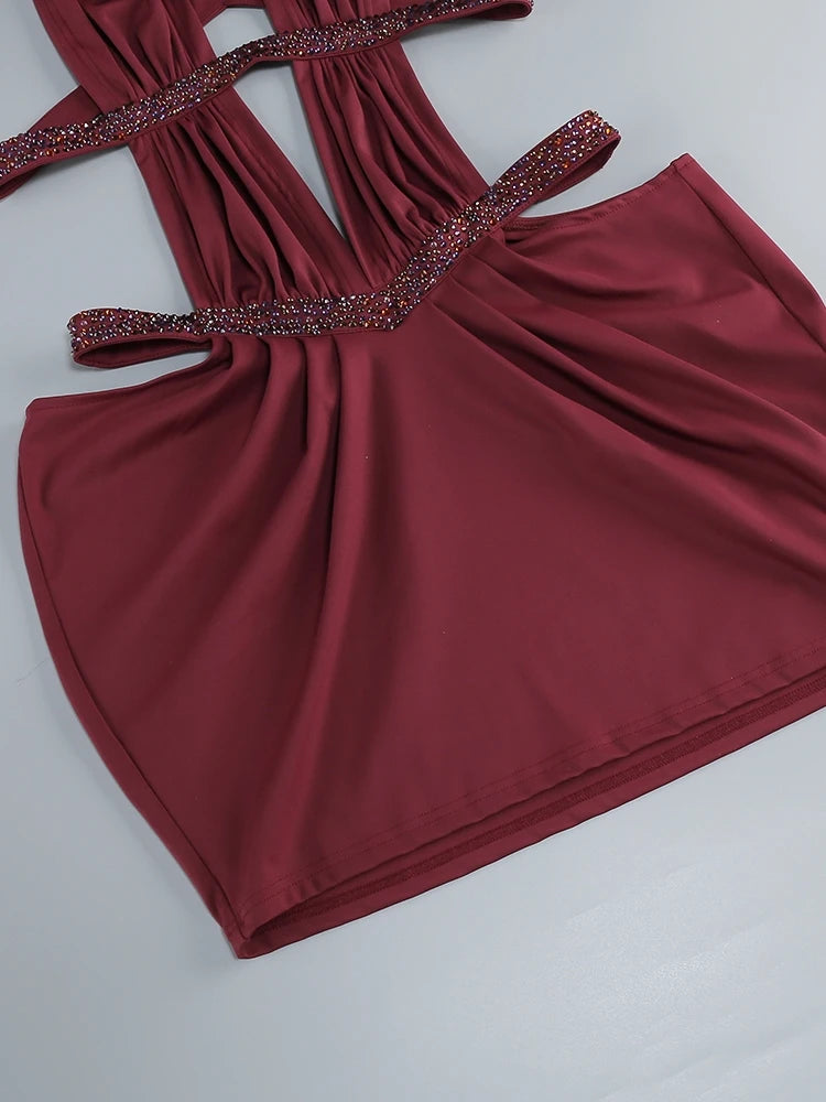 Burgundy ruched mini gown with crystal-studded halter straps and gathered skirt