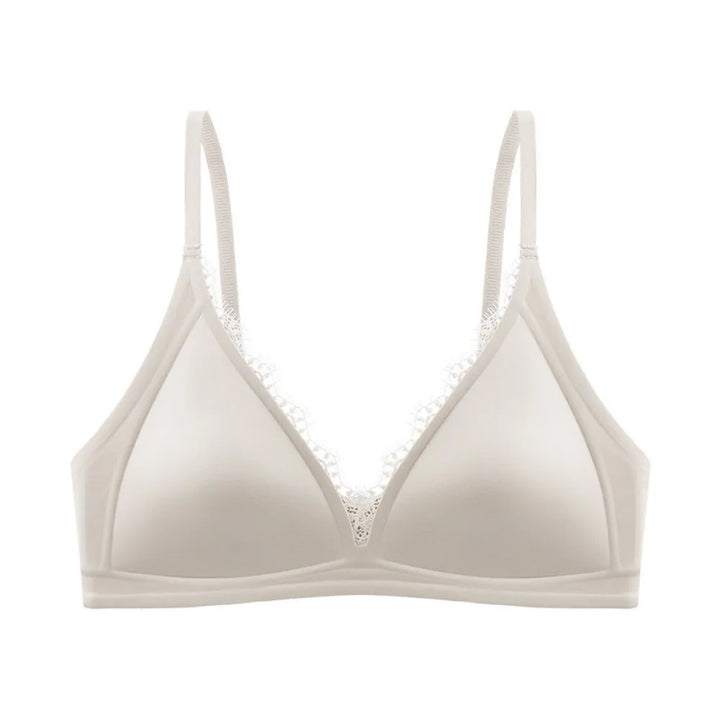 Light grey wireless V-neck satin bra with lace trim and seamless, traceless straps.