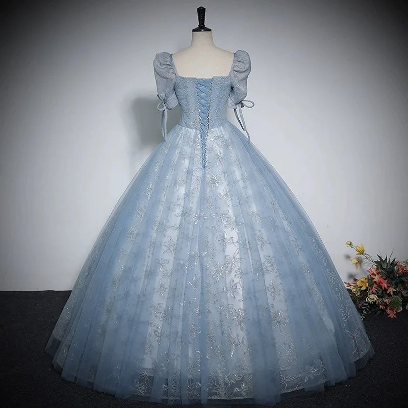 Light blue shiny ball gown with off-shoulder puff sleeves and bow-tied straps