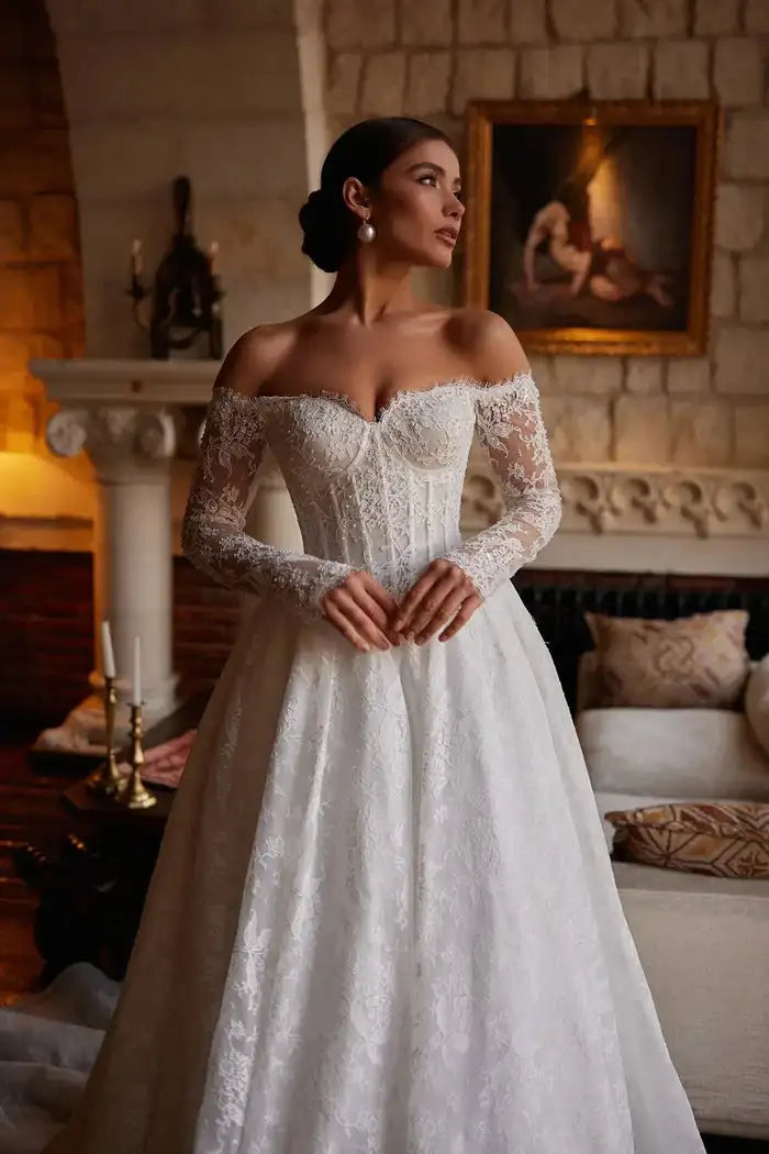 Lace A-line wedding gown with sweetheart neckline, off-shoulder straps, long sleeves