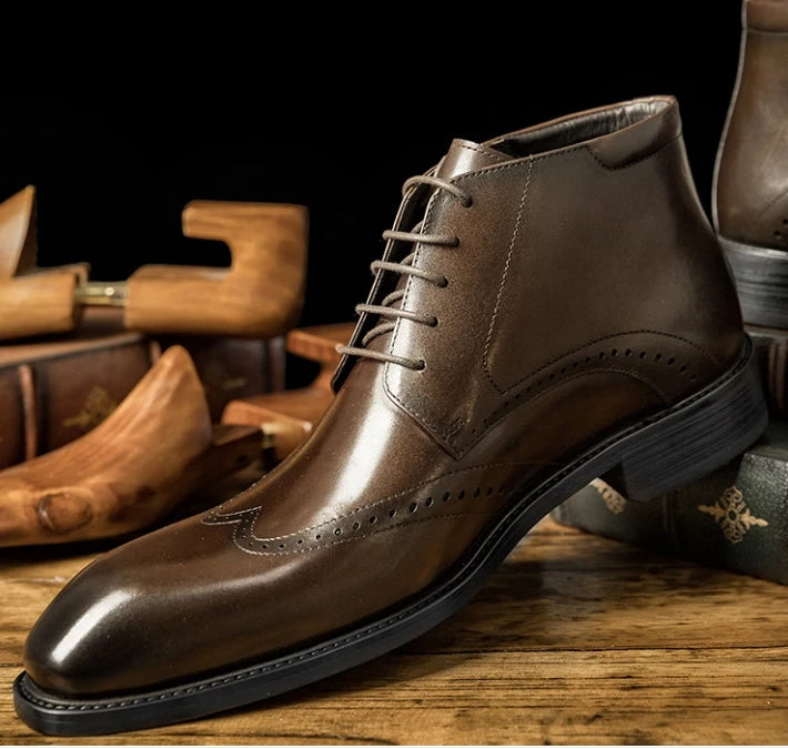 Brown lace-up brogue ankle boots with wingtip accents and low stacked heel