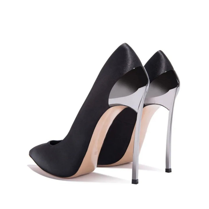 Pair of black pointed-toe slip-on pumps with tall silver stiletto heels