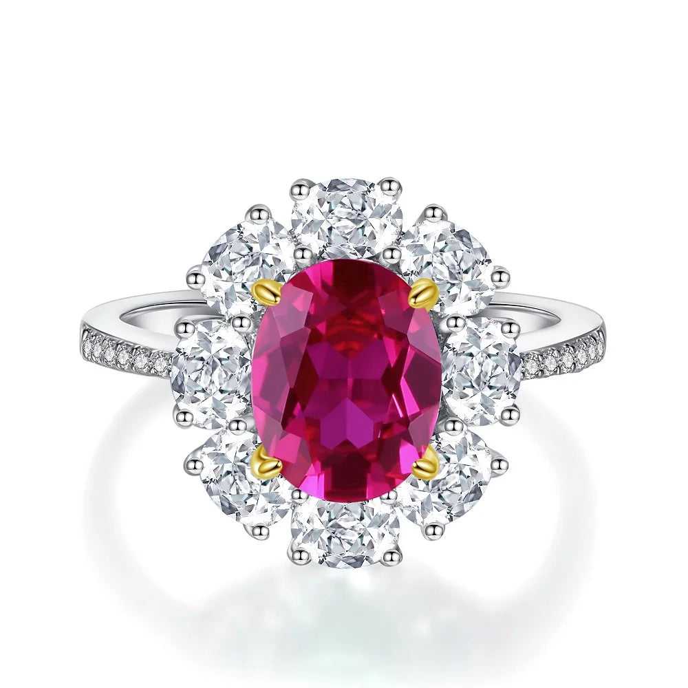 Diamond halo ring with oval magenta center stone and round diamond accents