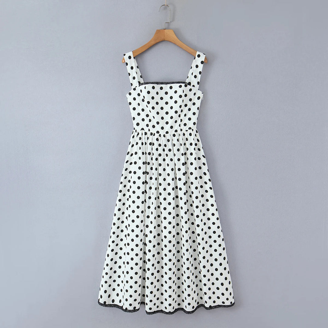 White polka-dot swing midi dress with sleeveless square neckline and full skirt