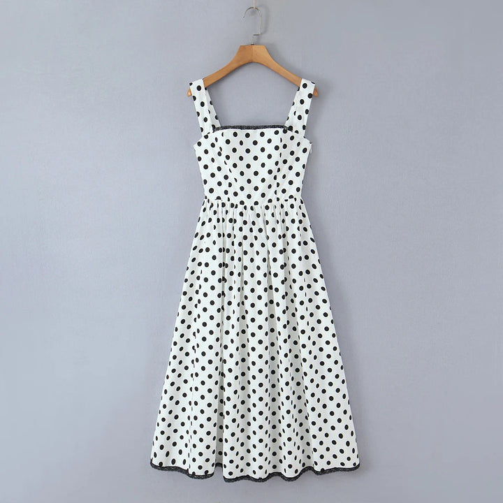 White polka-dot swing midi dress with sleeveless square neckline and full skirt